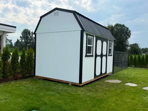 White barn-style shed, photo 1 of 3