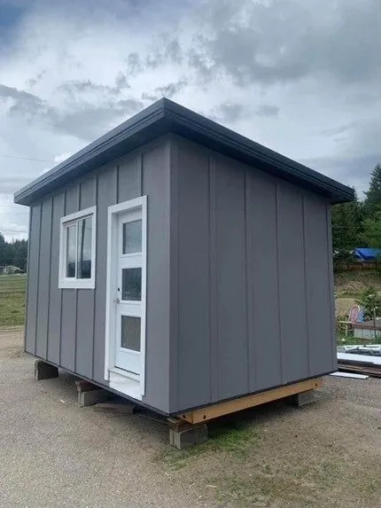 Grey shed with a glass-panel door